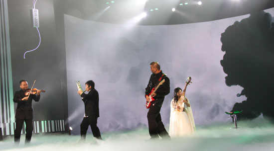 Artists perform at the 6th China National Garment Association Awards at the Century Theater in Beijing on March 28, 2010. 