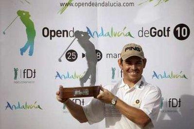 Louis Oosthuizen of South Africa poses with his trophy after winning the Andalucia Open golf tournament in Malaga, southern Spain, March 28, 2010.