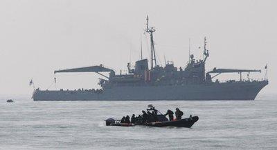 South Korean Navy&apos;s Ship Salvage Unit members search for survivors from the sunken South Korean navy ship near South Korea&apos;s Baengnyeong Island on Monday, March 29, 2010. The 1,200-ton Cheonan, exploded and sank near the tense maritime border with North Korea late Friday.