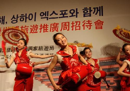 Chinese actresses perform dancing during the launching ceremony of the '2010: year to visit China, the promoting week of 2010 World Expo' in Seoul, capital of Republic of Korea(ROK), on March 30, 2010. The activity will be held in different cites in ROK to promote the 2010 World Expo in Shanghai. 