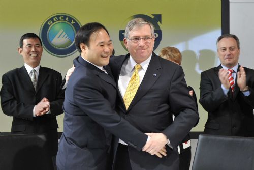 Geely Chairman Li Shufu (FRONT L) shakes hands with CFO of Ford Motor Company, Lewis Booth (FRONT R) after signing a deal to take over Volvo in Goteborg of Sweden, March 28, 2010.