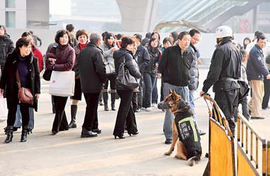 Patrol units with sniffer dogs are deployed at entrances to the subway in Shanghai as part of enhanced security measures before and during the Expo.