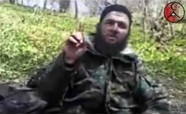 Chechen rebel leader Doku Umarov is seen in this screenshot taken March 31, 2010. Umarov claimed responsibility for suicide bombings in the Moscow metro that killed at least 39 people, according to a video posted on an unofficial Islamist rebel website on Wednesday. [Xinhua]