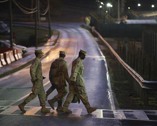 Guards walk inside the detention facility at Guantanamo Bay U.S. Naval Base, Cuba, Monday, March 30, 2010.[Xinhua/AFP] 