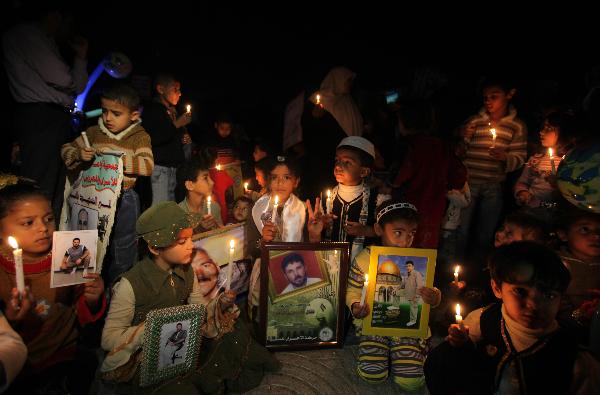 Palestinian children participate in a protest calling for the release of Palestinian prisoners and the end of Israeli blockade, in Gaza City on April 5, 2010. [Wissam Nassar/Xinhua]