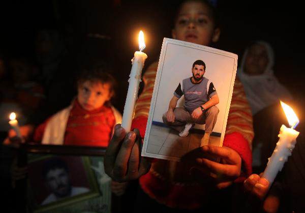 Palestinian children participate in a protest calling for the release of Palestinian prisoners and the end of Israeli blockade, in Gaza City on April 5, 2010. [Wissam Nassar/Xinhua]