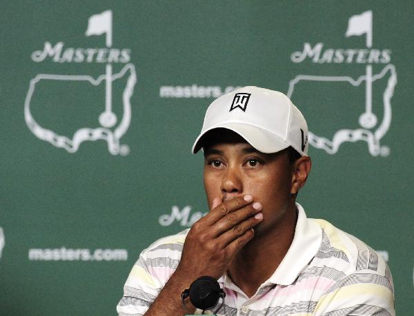 Tiger Woods reacts at his news conference following his practice round for the 2010 Masters golf tournament at the Augusta National Golf Club in Augusta, Georgia, April 5, 2010. (Xinhua/Reuters Photo)   