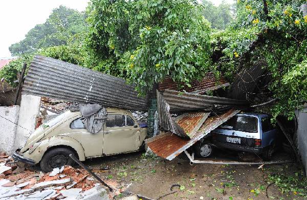 Cars are damaged after a landslide hit the neighbourhood of Ilha Governador in Rio de Janiero. The death toll in severe floods in Brazil triggered by torrential rains has risen to 95 across the state of Rio de Janiero, officials said.[Xinhua]