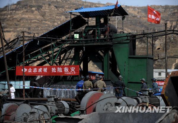 Rescuers walk to the flooded Wangjialing Coal Mine in north China's Shanxi Province again after continuously working for more than 10 hours underground early on April 6, 2010.