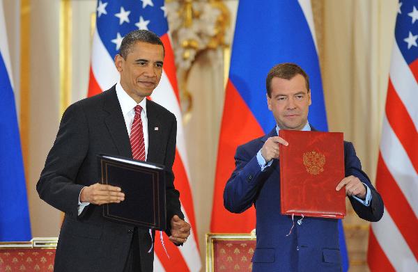 U.S. President Barack Obama (L) and his Russian counterpart Dmitry Medvedev sign a landmark nuclear arms reduction treaty in Prague, capital of Czech Republic on April 8, 2010. (Xinhua