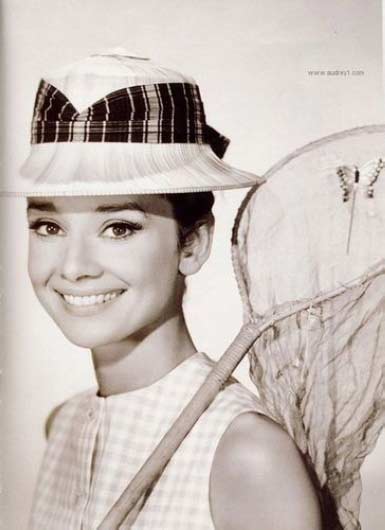 A rarely-seen photo of Audrey Hepburn wearing a hat. 