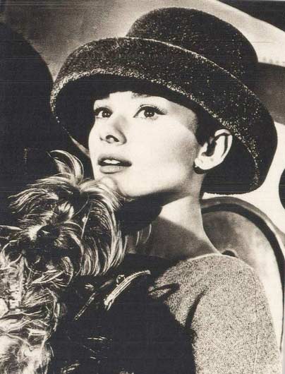 A rarely-seen photo of Audrey Hepburn wearing a hat. 