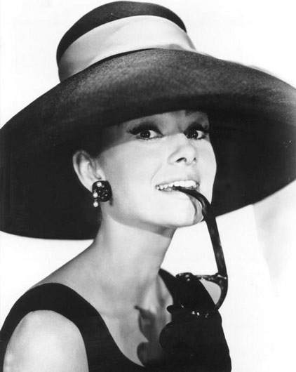 A rarely-seen photo of Audrey Hepburn wearing a hat. 