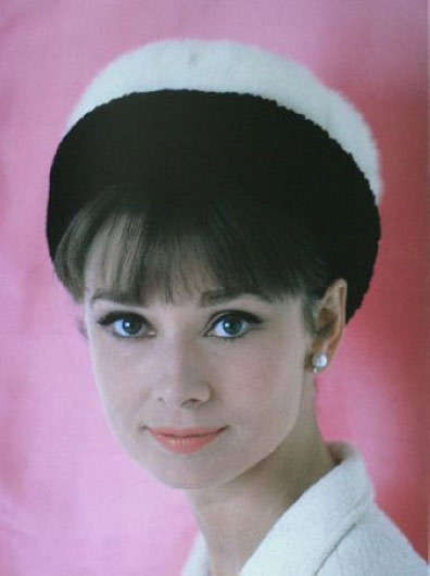 A rarely-seen photo of Audrey Hepburn wearing a hat. 