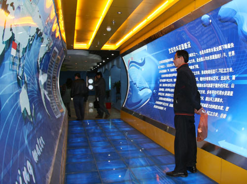 A visitor examines an exhibit on the history of water at the Beijing Water Conservation Museum in western Beijing on Wednesday, April 7, 2010. [CRIENGLISH.com] 