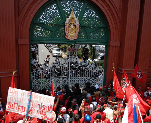 Police and anti-government protesters known as 'red-shirts' clash in Thailand‎ on April 7, 2010. Thailand's criminal court on Friday approved to issue arrest warrants against three core leaders of anti-government protesters known as 'red-shirts' who caused the shutdown of the Rathchaprasong Intersection, a major commercial area in the capital Bangkok.