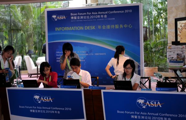 Staff members work at the reception center at the conference hall for the Boao Forum for Asia (BFA) 2010 in Boao, a scenic town in south China's Hainan Province, April 8, 2010. BFA 2010 meeting will be held from April 9 to 11.