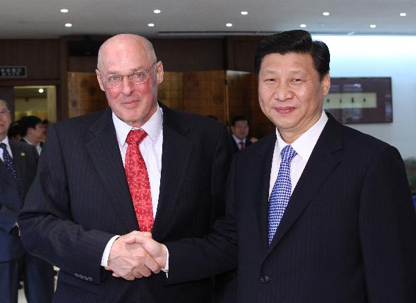 Chinese Vice President Xi Jinping (R) meets with former U.S. Treasury Secretary Henry Paulson, who was elected as a member of the board of directors of Boao Forum for Asia (BFA), in Boao, a scenic town in south China's Hainan Province, April 9, 2010. 