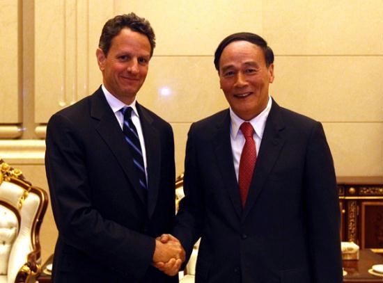 Special representative of Chinese President Hu Jintao, Vice Premier Wang Qishan (R) meets with special representative of U.S. President Barack Obama, Treasury Secretary Timothy Geithner in Beijing, April 8, 2010. [Xinhua] 