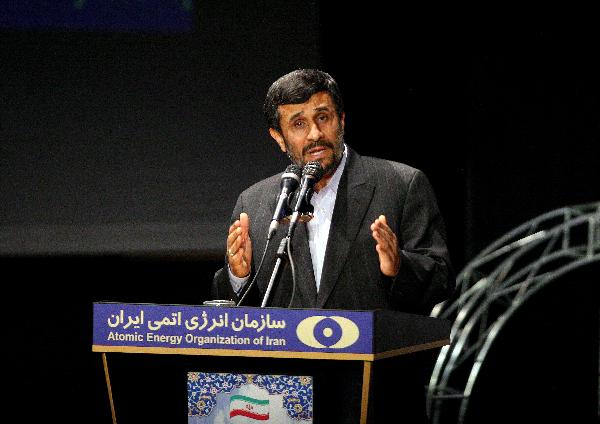 Iran's President Mahmoud Ahmadinejad unveils the first sample of the third generation of centrifuges during a ceremony marking Iran's annual National Nuclear Day in Tehran, capital of Iran, April 9, 2010. [Ahmad Halabisaz/Xinhua]