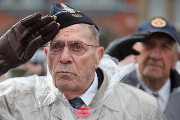 Veterans salute at the Vimy Ridge Day commemoration at Ottawa, capital of Canada, April 9, 2010. Canada held a grand ceremony at the National War Memorial in Ottawa on Friday, officially marked the end of an era as the country's last known World War I veteran John Babcock was gone earlier.