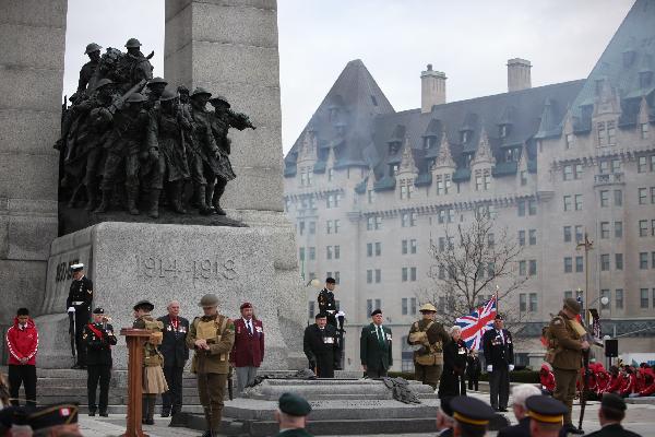 Delegates mourn at the Vimy Ridge Day commemoration at Ottawa, capital of Canada, April 9, 2010. Canada held a grand ceremony at the National War Memorial in Ottawa on Friday, officially marked the end of an era as the country's last known World War I veteran John Babcock was gone earlier.