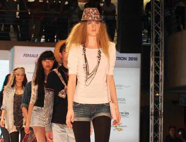 Models present designs during a fashion show at Paragon shopping mall in Singapore, April 10, 2010. The event showcased 10 international brands with 125 models presenting creations. It is also a part of this year's six-week Fashion Season at Orchard campaign in Singapore.