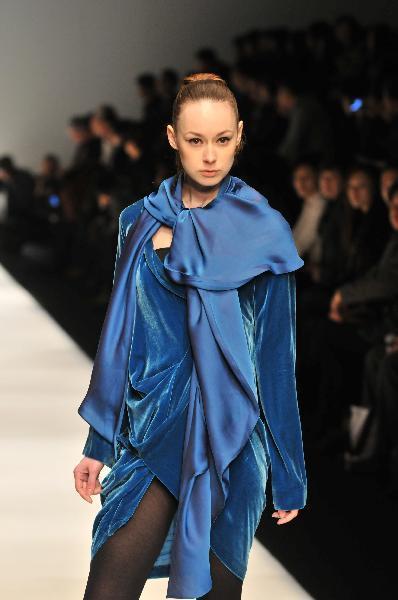 A model presents a creation by fashion designer Pari Chen during the 2010 Shanghai Fashion Week in Shanghai, east China, April 9, 2010.