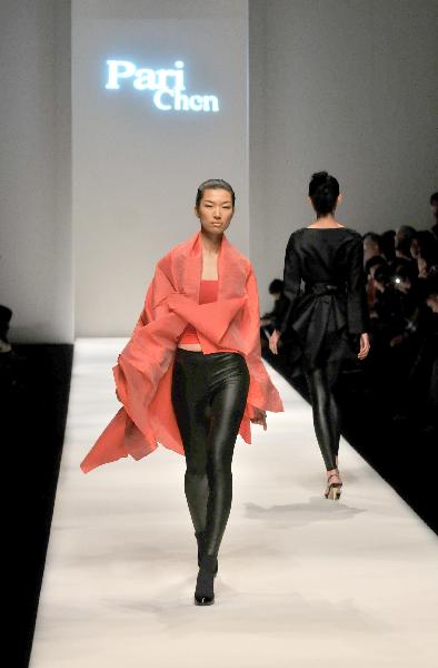 A model presents a creation by fashion designer Pari Chen during the 2010 Shanghai Fashion Week in Shanghai, east China, April 9, 2010.