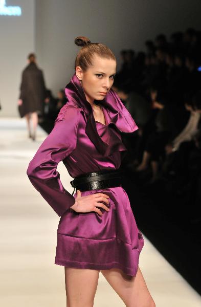 A model presents a creation by fashion designer Pari Chen during the 2010 Shanghai Fashion Week in Shanghai, east China, April 9, 2010.