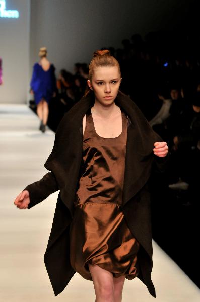 A model presents a creation by fashion designer Pari Chen during the 2010 Shanghai Fashion Week in Shanghai, east China, April 9, 2010.