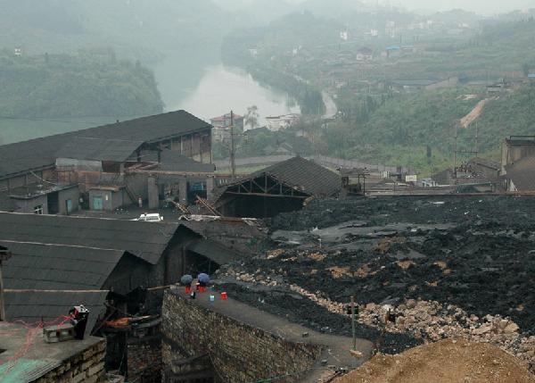 This photo taken on April 11, 2010 shows the site of the manganese mine dreg overflow accident in Huayuan County in central China's Hunan Province. One worker was killed and five are still missing after more than 400 cubic meters of manganese mine dregs overflowed from a mine dregs retaining pond at the company Saturday. The landslide happened when 35 workers were working to close down the pond. 29 were evacuated and 6 were buried.