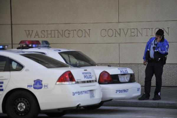 Police cars park outside the Washington Convention Center in Washington D.C., capital of the United States, April 11, 2010. Washington beefed up its security for the upcoming Nuclear Security Summit due on April 12 and 13. [Zhang Jun/Xinhua]
