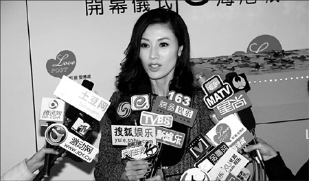 Former Miss Hong Kong Li Jiaxin responds to media questions during a charity event in Hong Kong. Her picture is now a popular computer desktop image of many white-collar workers on the mainland. It's being used as a humorous way of reminding bosses about salary increases because the pronunciation of Jiaxin is the same as the Chinese phrase for pay rise. [China Daily]