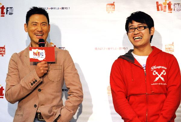 Jacky Cheung, a Hong Kong pop music star singer, enjoys a happy moment with one of his song fans who confesses his personal story, during the fans club meeting marking Jacky Cheung's new album release, in Taipei, southeast China's Taiwan, April 12, 2010. 