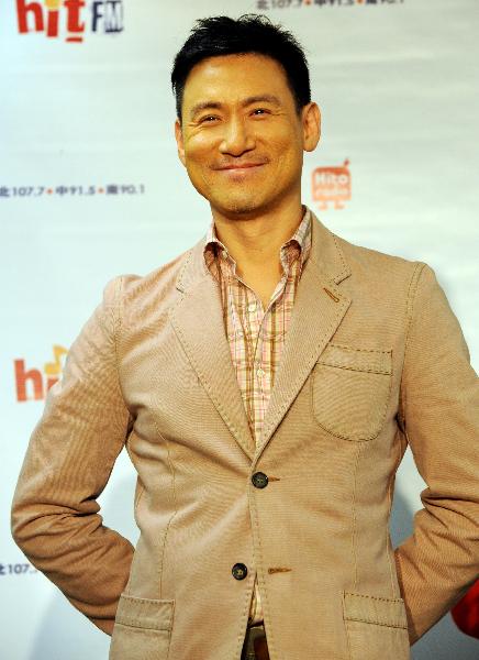 Jacky Cheung, a Hong Kong pop music star singer, smiles while interacting with the song fans, during the fans club meeting marking his new album release, in Taipei, southeast China's Taiwan, April 12, 2010.