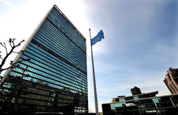 The UN flag is hoisted at half-mast to mourn the deaths of Polish President Lech Kaczynski and 87 other members of a Polish delegation who were killed in a plane crash on Saturday morning, at the UN Headquarters in New York, the United States, April 12, 2010. [Shen Hong/Xinhua]