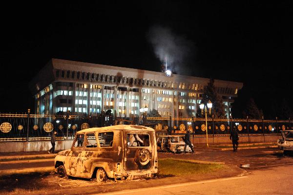 Burned cars are seen outside the presidential palace in Bishkek, capital of Kyrgyzstan, April 8, 2010. The Kyrgyz presidential palace has been occupied by the opposition protesters, and a new government, led by Roza Otunbayeva, the country's former foreign minister and leader of the Social Democratic faction, has been formed, key opposition leader Temir Sariev claimed on Wednesday. [Sadat/Xinhua]