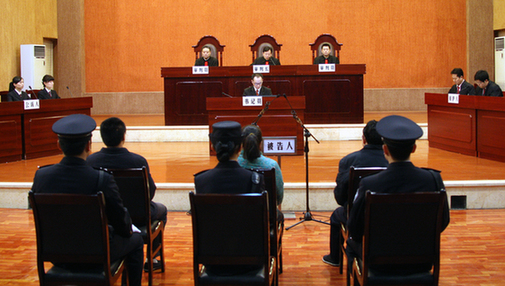 Wen Qiang stands trial Wednesday morning. [Xinhua]