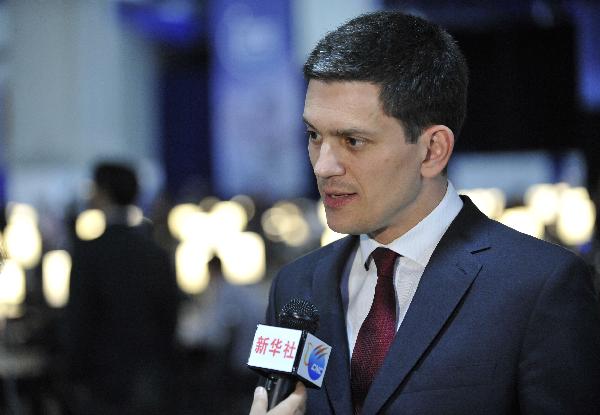 David Miliband, British Secretary of State for Foreign and Commonwealth Affairs, receives interview from Xinhua News Agency during the ongoing Nuclear Security Summit in Washington D.C., capital of the United States, April 12, 2010. [Zhang Jun/Xinhua]