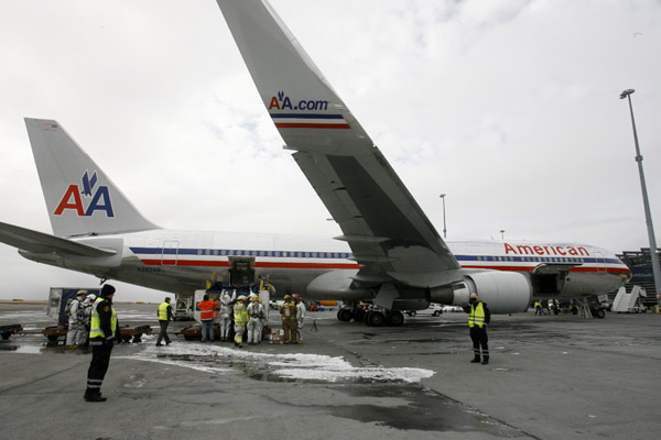 American Airlines Flight 49, right, traveling from Paris to Dallas-Ft. Worth is seen on the tarmac of Keflavik airport, Iceland after an emergency landing, Tuesday, April 13 , 2010. (Xinhua/AFP Photo)