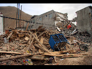 Debris are seen following a 7.1 magnitude earthquake which struck China's Qinghai province just before 8am local time on April 14, 2010 in Yushu county, Qinghai province of China. Reports stood at 400 dead with about 8000 injured. Whilst the high altitude region is promise to quakees, the US Geological Survey reported this to be the strongest since 1976. [Xinhua]