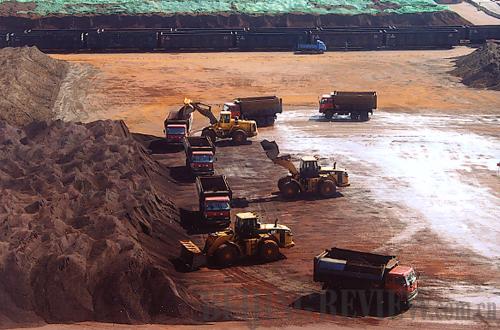 Busy port: The iron ore dock at Caofeid an Port in Tianjin bustles with activity. [Beijing Review]