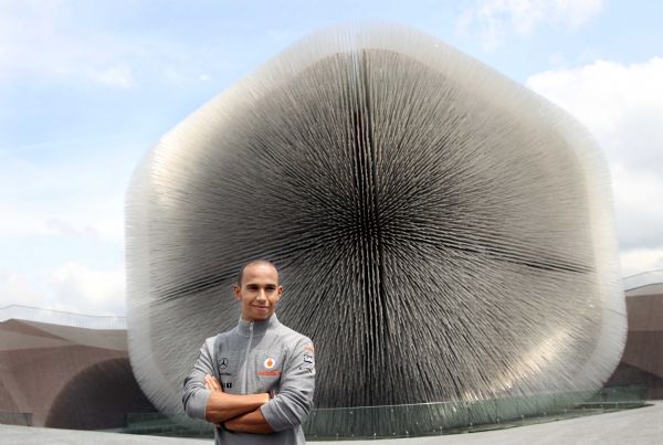 Great Britain's Lewis Hamilton of McLaren F1 team poses in front of the UK Pavilion in World Expo Park in Shanghai, east China, April 15, 2010. Hamilton is here for the F1 Grand Prix slated on Sunday.