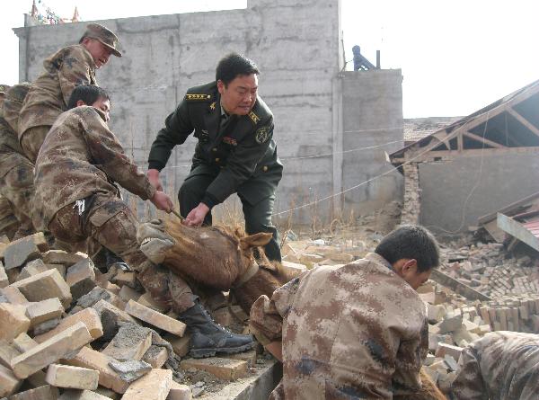 Officers and soldiers of the Chinese People's Liberation Army work in a rescue operation in the rubbles of destroyed houses in Yushu County, northwest China's Qinghai Province, April 14, 2010. About 400 people have died and 10,000 others were injured after a 7.1-magnitude earthquake hit Yushu early on Wednesday. 