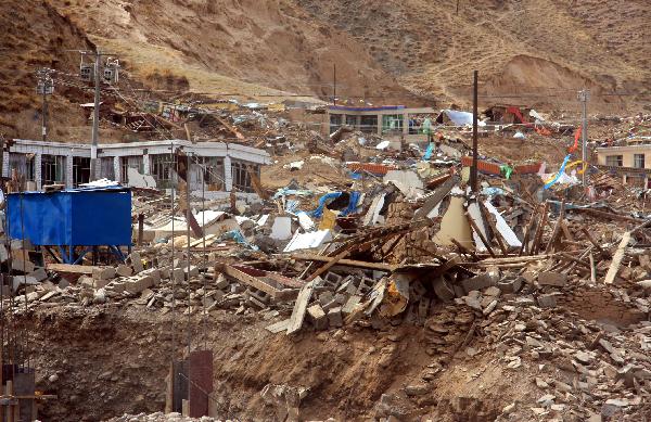 Photo taken on April 14, 2010 shows the ruins of collapsed houses after an earthquake in Yushu County, northwest China's Qinghai Province. About 400 people have died and 10,000 others were injured after a 7.1-magnitude earthquake hit Yushu early on Wednesday. 