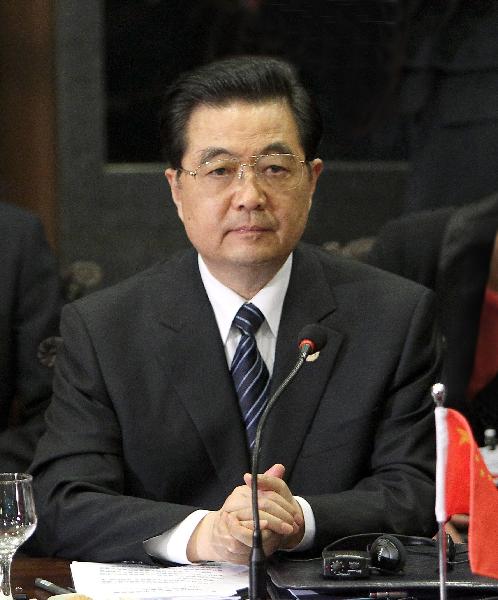 Chinese President Hu Jintao attends the second summit meeting of BRIC (Brazil, Russia, India and China) leaders in Brasilia, capital of Brazil, April 15, 2010. [Ju Peng/Xinhua] 