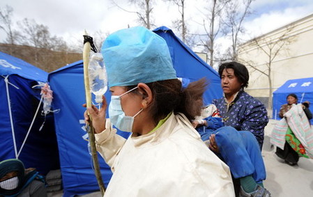 An injured student receives first-aid in quake-hit Yushu April 15, 2010. 