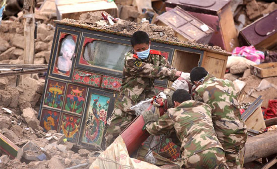 Rescuers search for victims in the ruins of a 7.1-magnitude earthquake hit Yushu Tibetan Autonomous Prefecture in Qinghai province early on Wednesday. 