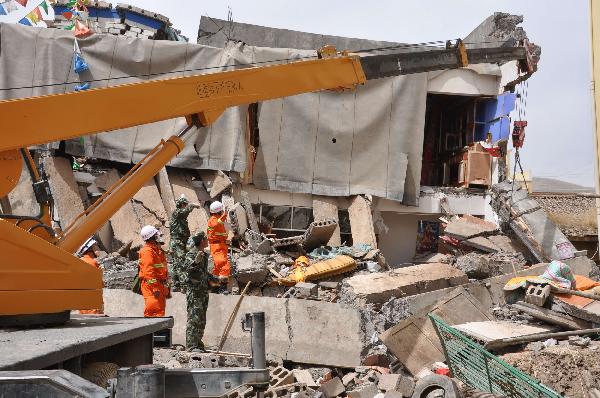Rescuers work in a sustaining operation of searching for survivors among debris in quake-hit Yushu County, northwest China's Qinghai Province, April 16, 2010. A dragnet serach for survivors is implemented throughly at all rescuing sites as the 'golden 72 hours', a key surviving chance for buried people comes on Friday. Qinghai's Tibetan Autonomous Prefecture of Yushu was jolted by a 7.1-magnitude earthquake Wednesday morning, which has left at least 1,144 people dead.